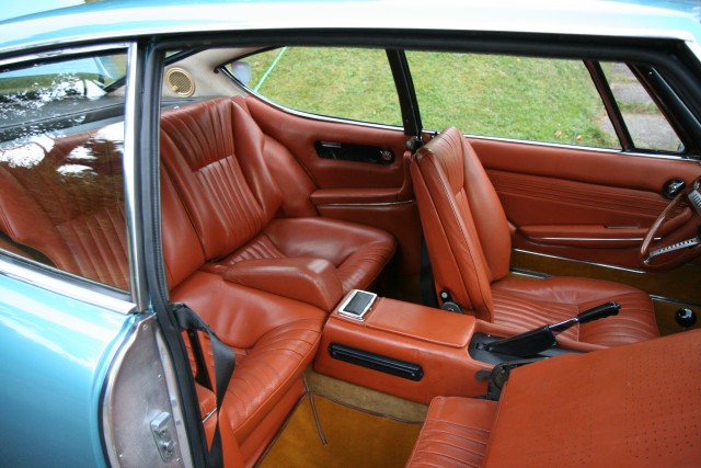 Original leather. Back seats, also showing holes in the back of the front seat.