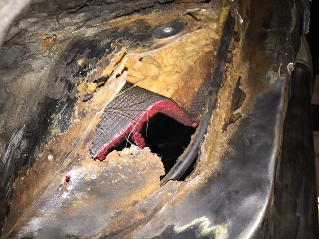 Big hole from underneath - also some nasty rust in the box section that runs under the floor
